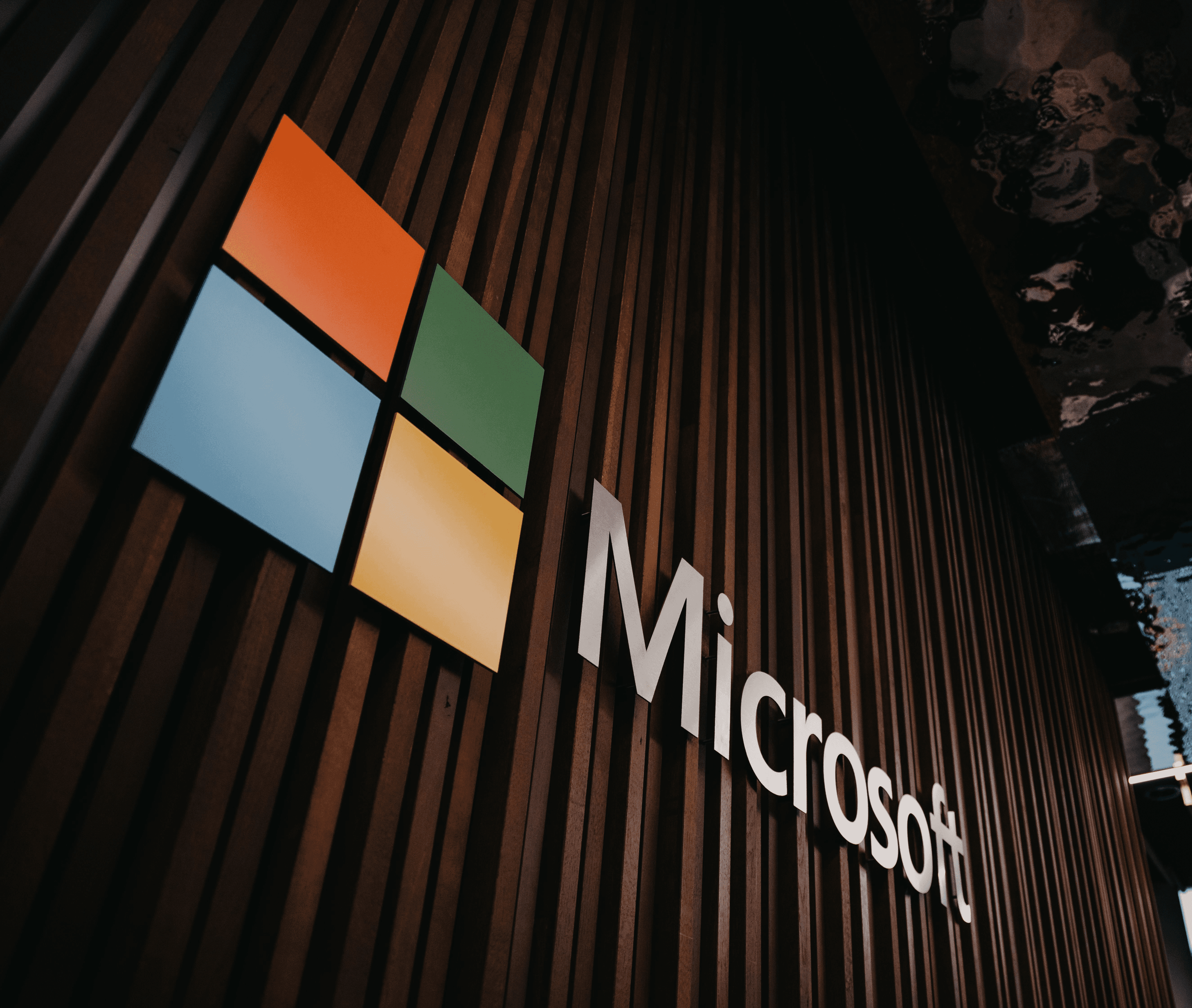 Microsoft logo and name on the exterior of a building.