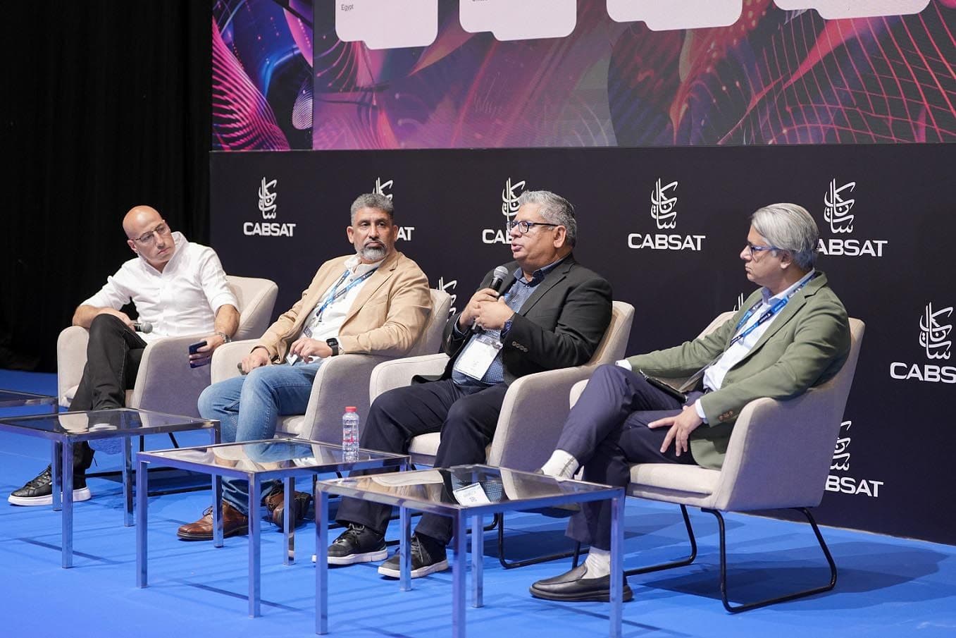 Four speakers seated on a conference panel in front of a CABSAT backdrop.